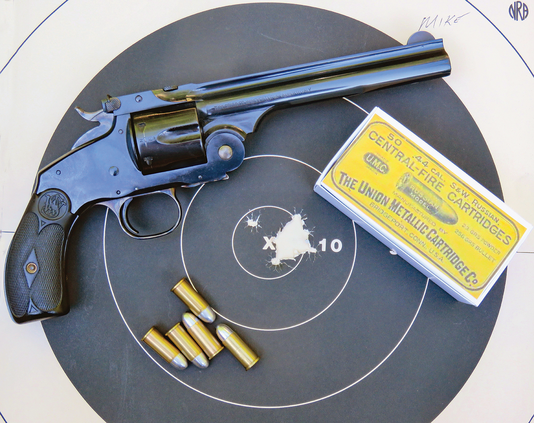The .44 and outfit is shown with one of the practice targets.